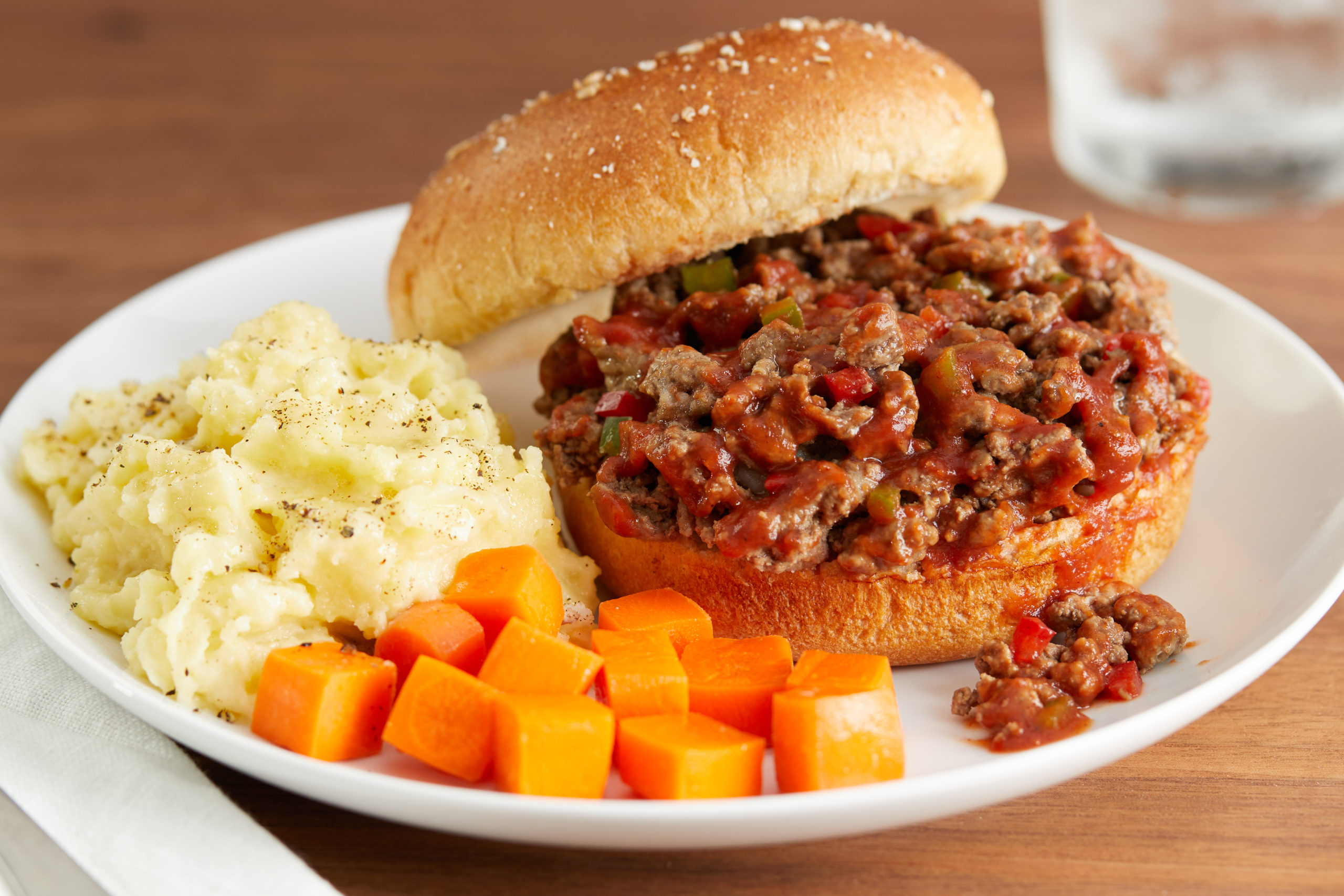 Sloppy joe meal with mashed potatoes and carrots