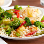 Sweet and sour vegetables meal over rice